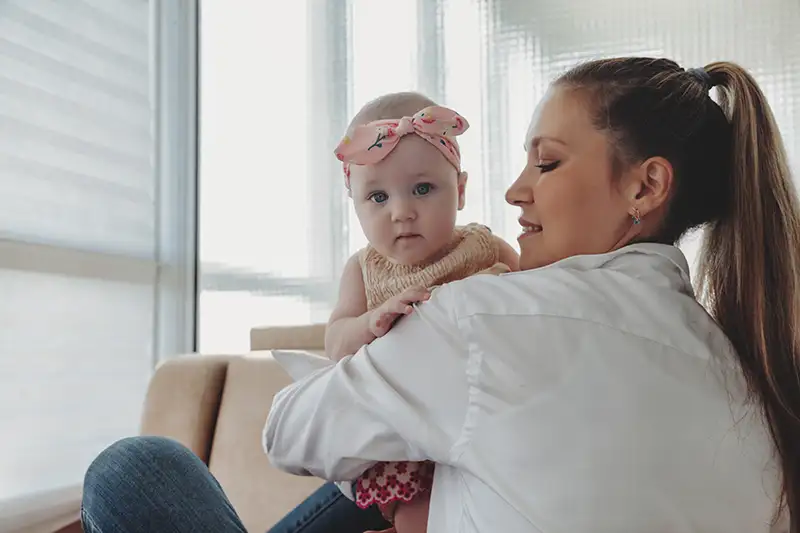 mother-holding-baby-after-ivf-in-the-us