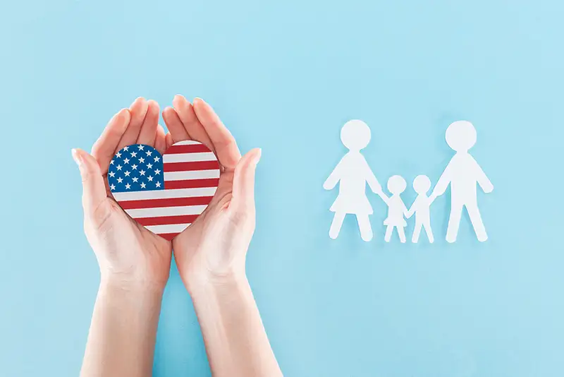 womans-hands-holding-heart-shaped-american-flag-for-ivf-in-the-us